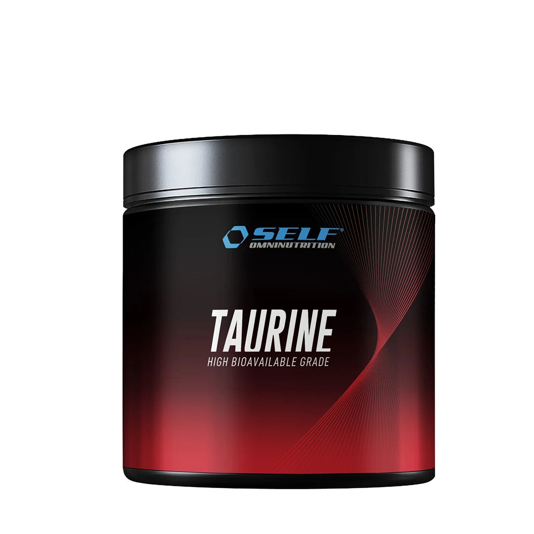 Self Omninutrition Amino Taurine 200 g rent taurinpulver i en svart og rød boks med sølvfarget tekst.
