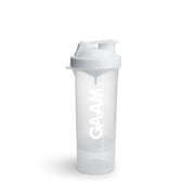 GAAM Smartshake Slim 500 ml shaker i genomskinlig plast med vitt lock, vit logotyp och ett extrafack i botten.