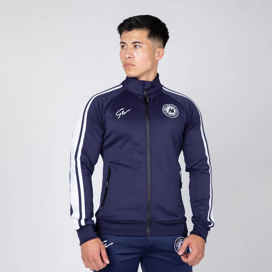 Gorilla Wear Stratford Track Jacket Navy, en marineblå treningsjakke i slim fit med hvite striper og høy krage., bilde 1 av 8