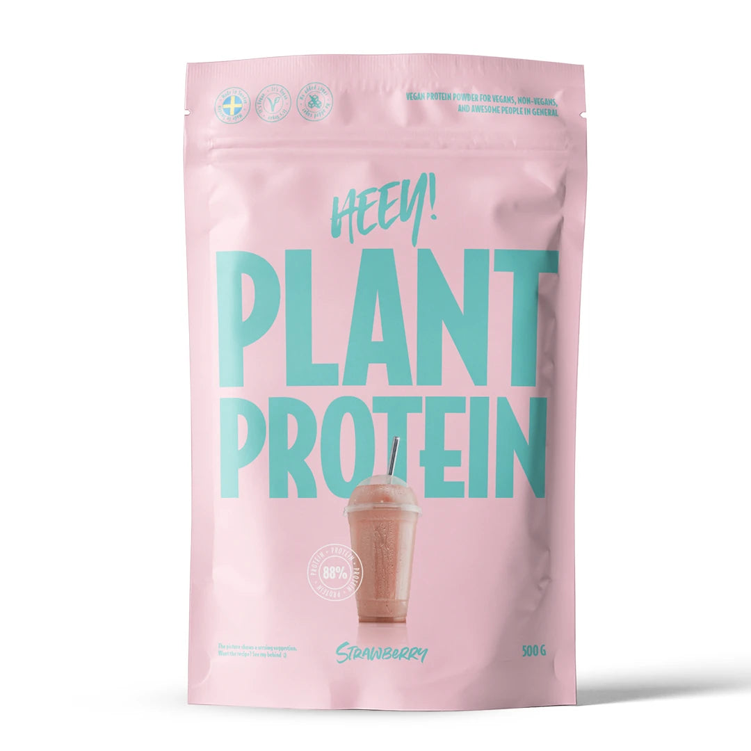 Heey! Vegansk Protein 500 g proteinpulver i en lyserosa pose med turkis tekst for smaken jordbær., bilde 2 av 9