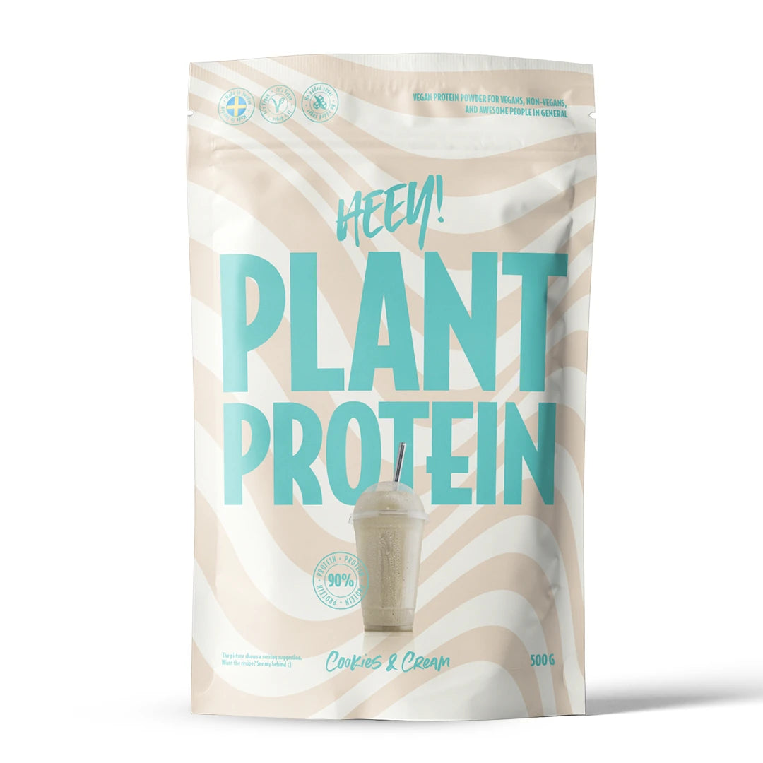 Heey! Vegansk Protein 500 g i en beige og hvit bølgete pose med turkis tekst for smaken Cookies &amp; Cream., bilde 4 av 9
