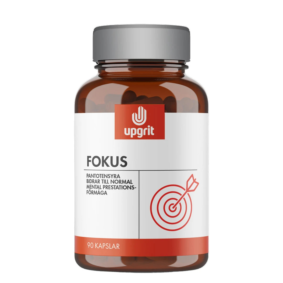 Upgrit Fokus 90 caps kosttilskudd i en brun boks med grått lokk, hvit etikett og rød blink.