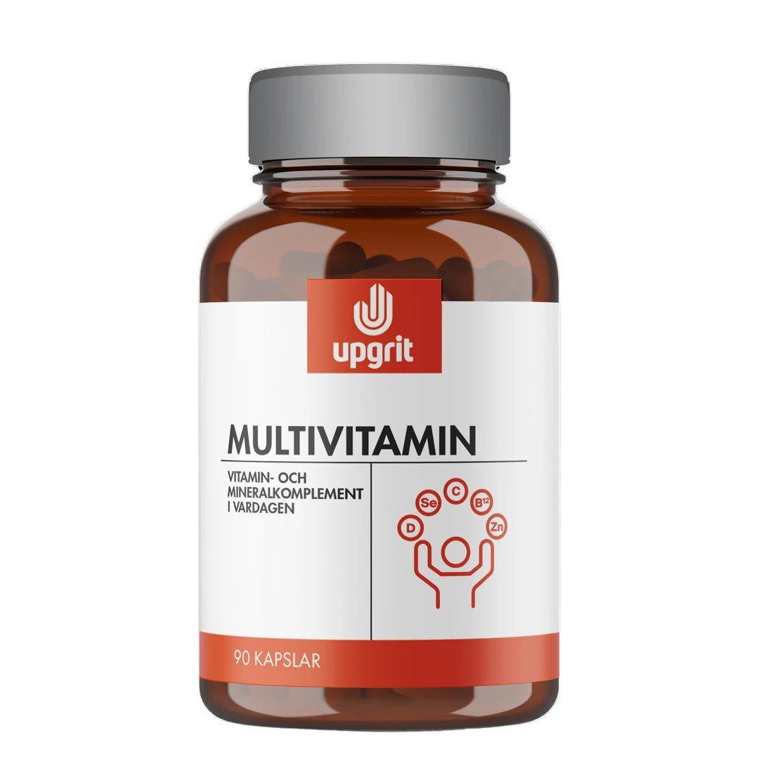 Upgrit Multivitamin 90 caps pakket i en mørkebrun boks med grått lokk og hvit etikett med røde detaljer.