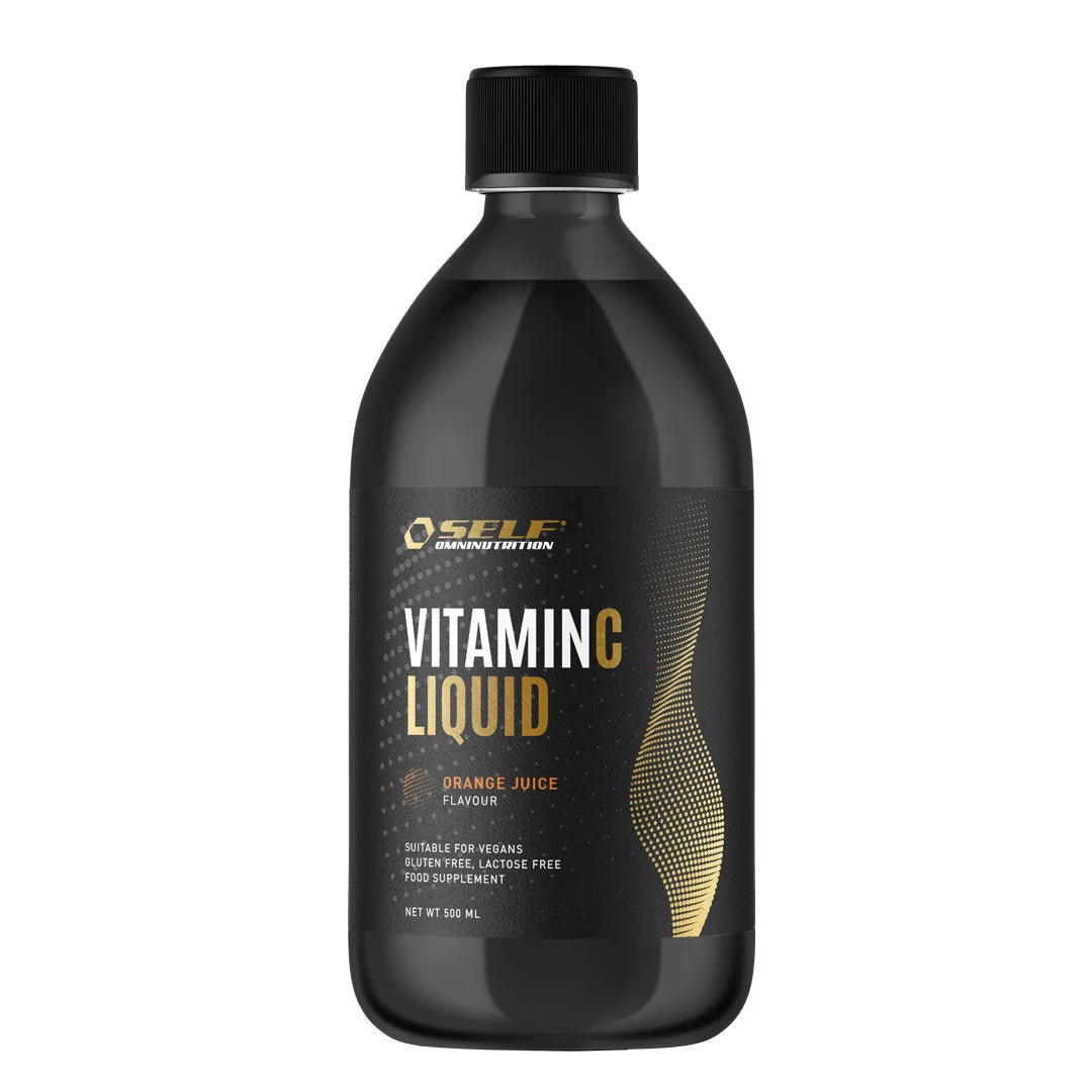 Self Omninutrition Vitamin C Liquid 500 ml flytende C-vitamin i en svart flaske med oransje og gullfargede detaljer.