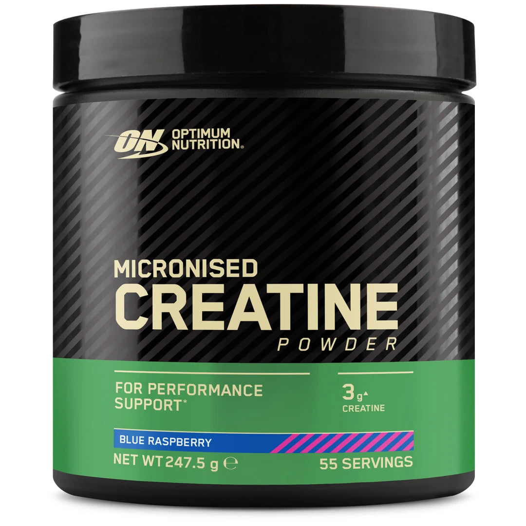Optimum Nutrition Creatine Powder 247.5 g i en svart boks med grønn etikett og smaken Blue Raspberry.