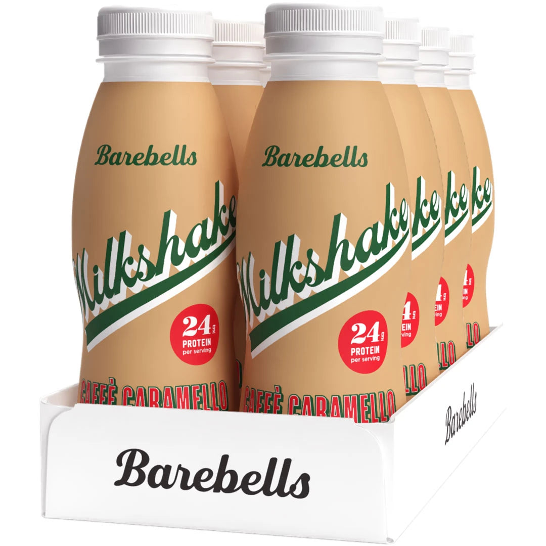 8 x Barebells Milkshake 330 ml Caffé Caramello i et hvitt brett med lysebrune flasker og grønne detaljer.