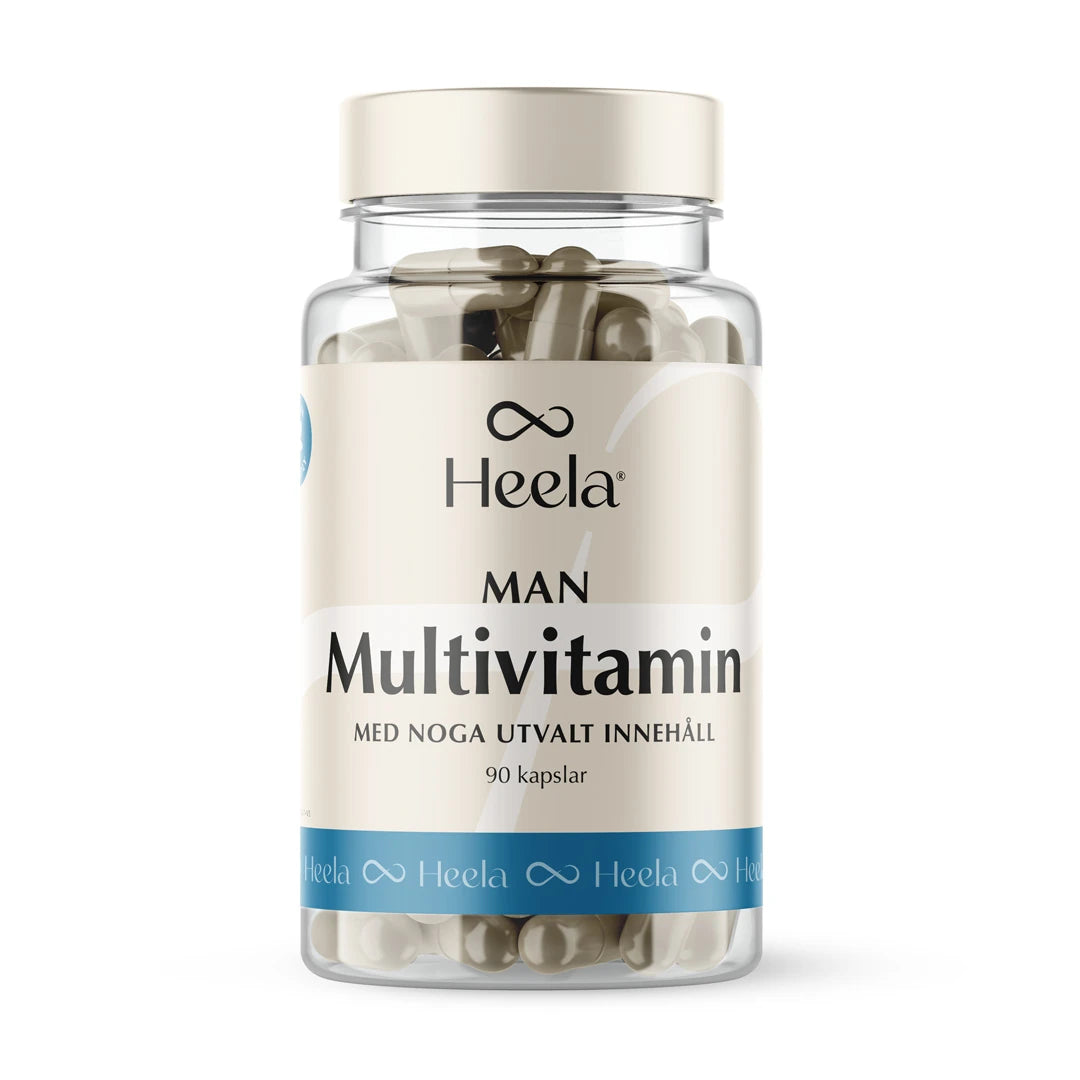 Heela Multivitamin Man 60 caps i en transparent plastboks med lys beige og blå etikett, samt et lyst skrulokk.