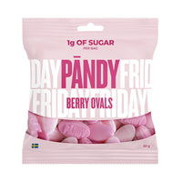 Pändy Candy 50 g Berry Ovals i en lyserosa godtepose med rosa og hvitt skumgodteri i bunnen.