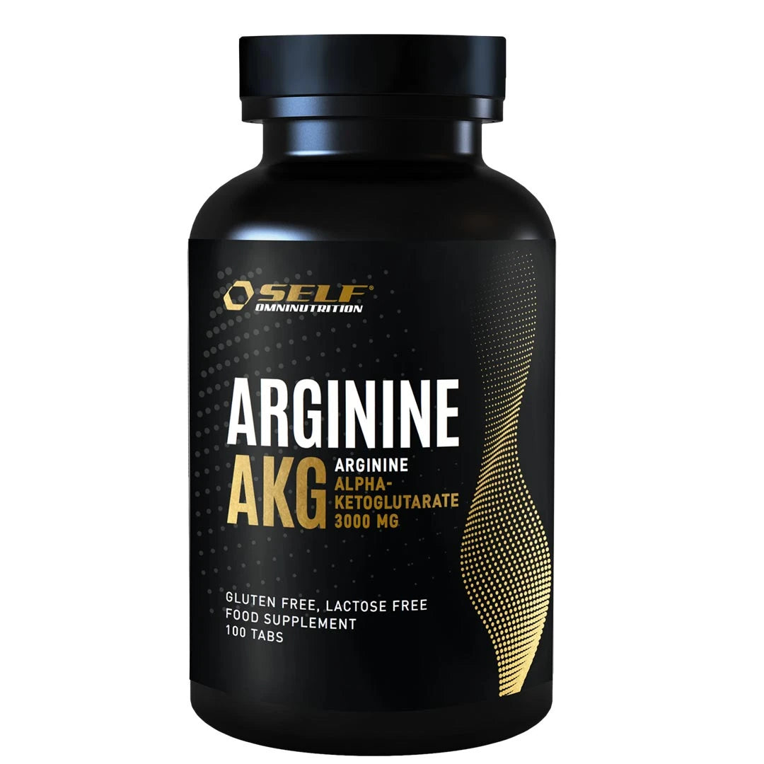 Self Omninutrition Arginine AKG 100 tabs, kosttilskudd i tablettform pakket i en svart boks med gulldetaljer.