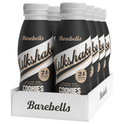 8 x Barebells Milkshake 330 ml Cookies & Cream i ett vitt flak med svarta flaskor och vita detaljer.