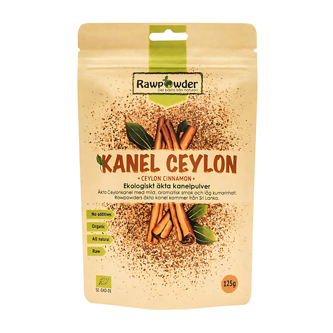 Rawpowder Kanel Ceylon 125 g økologisk kanelpulver, pakket i en beige pose med bilder av kanelstenger og grønne blader.