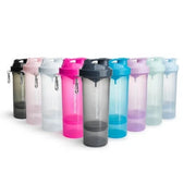 Smartshake Slim 500 ml shaker i plast, uppställd i flera olika livfulla färger med en mörkgrå i förgrunden.