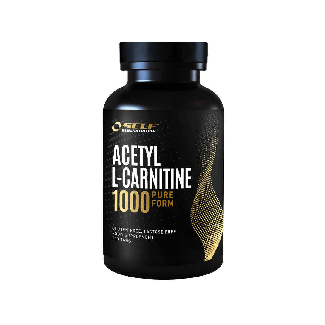 Self Omninutrition Acetyl L-Carnitine 1000 100 tabs kosttilskudd i en svart boks med gylne og hvite detaljer.