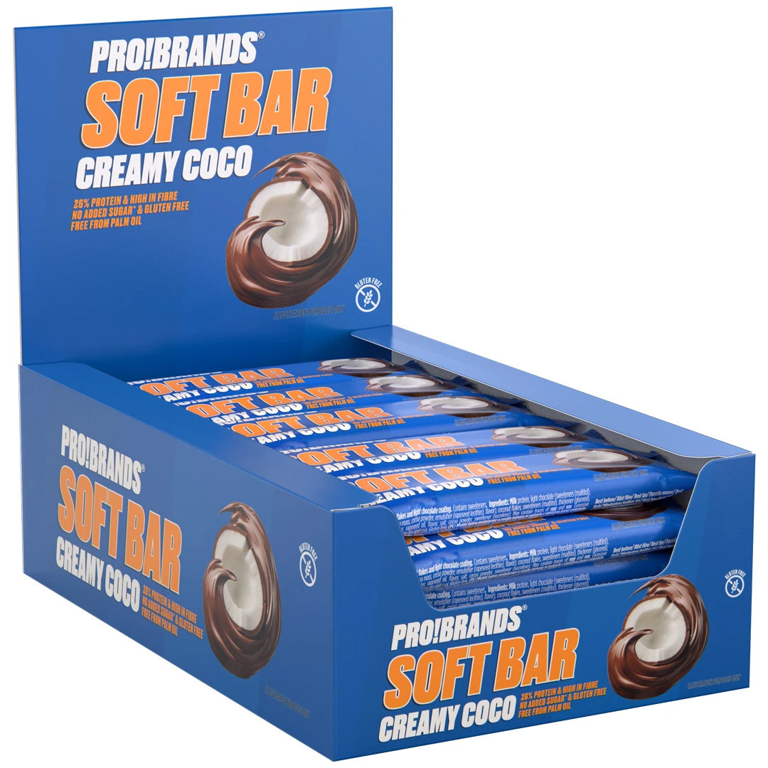 15 x Pro Brands Softbar 40 g Creamy Coco i en blå eske fylt med proteinbarer i blått omslag med kokos og sjokolade.