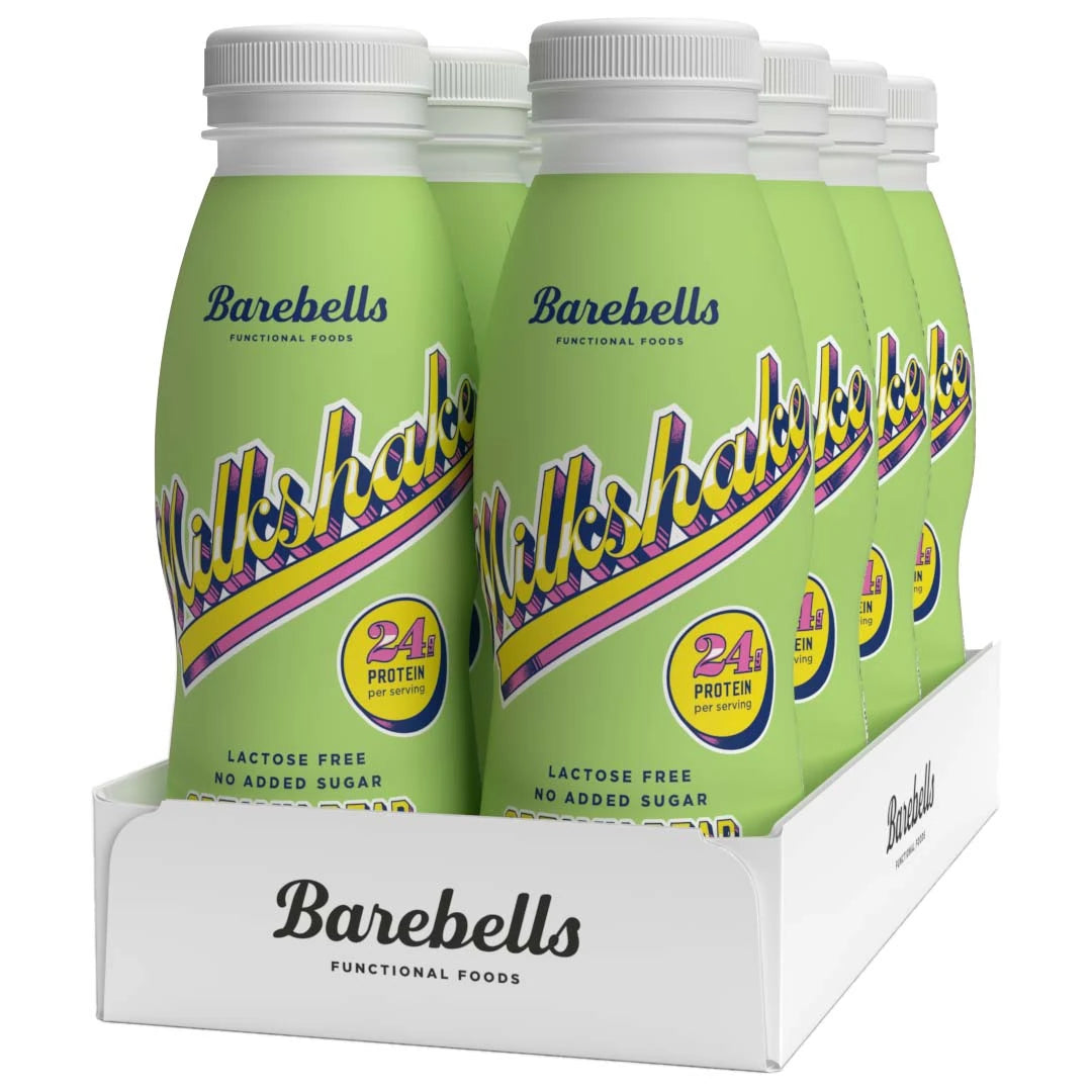 8 x Barebells Milkshake 330 ml Creamy Pear i en hvit kartong med lysegrønne flasker og retroinspirert tekst.