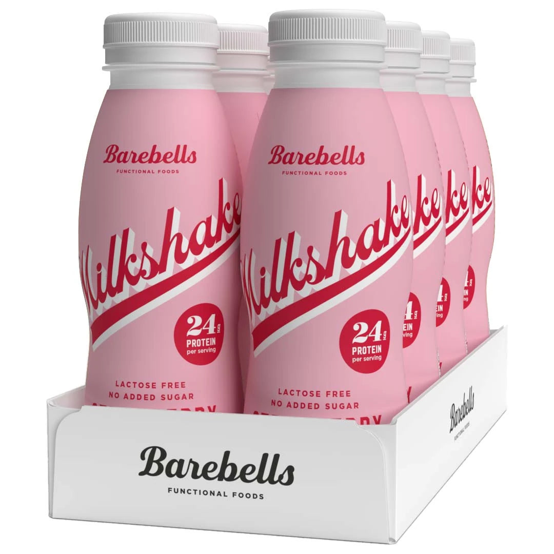 8 x Barebells Milkshake 330 ml Strawberry i en hvit kartong med rosa flasker og røde detaljer.