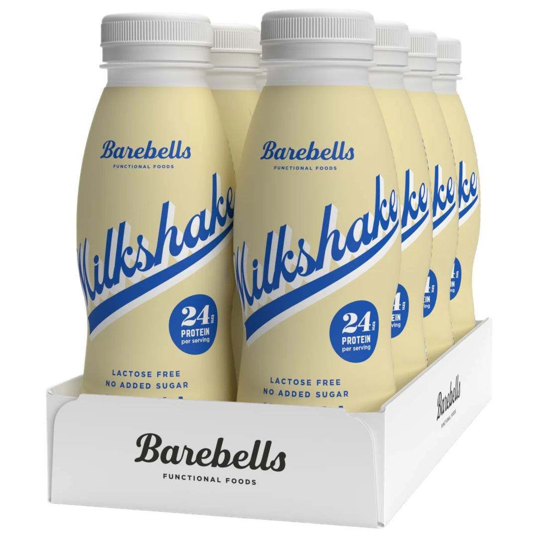 8 x Barebells Milkshake 330 ml Vanilla i lysegule flasker med blå tekst i en hvit kartong.