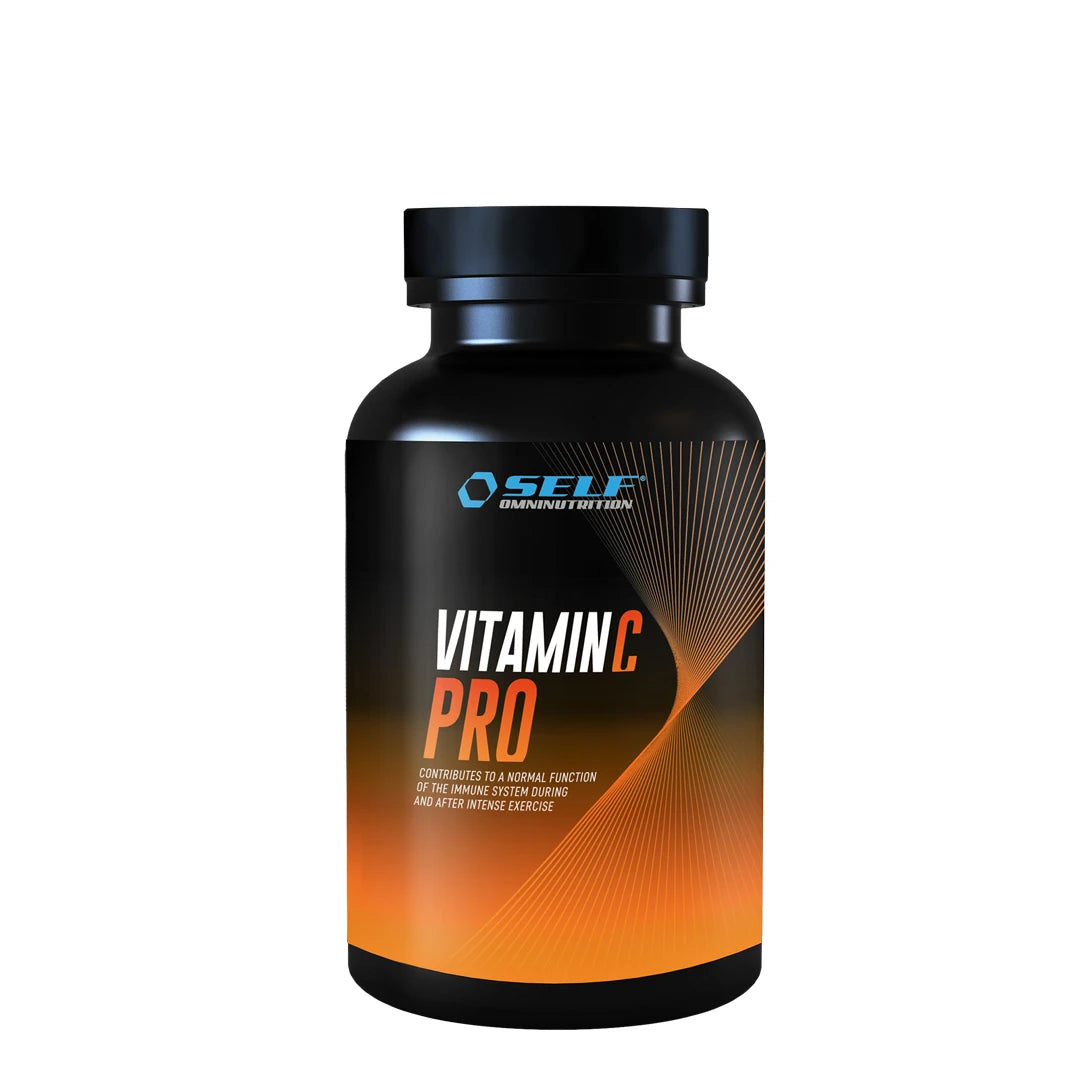 Self Omninutrition Vitamin C PRO 100 Tabs, kosttilskudd pakket i en svart boks med oransje detaljer.