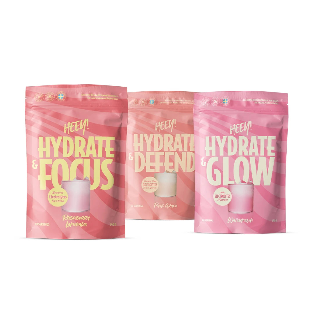 Heey! Hydration Paket med tre rosa og ferskenfargede poser fylt med elektrolyttpulver.