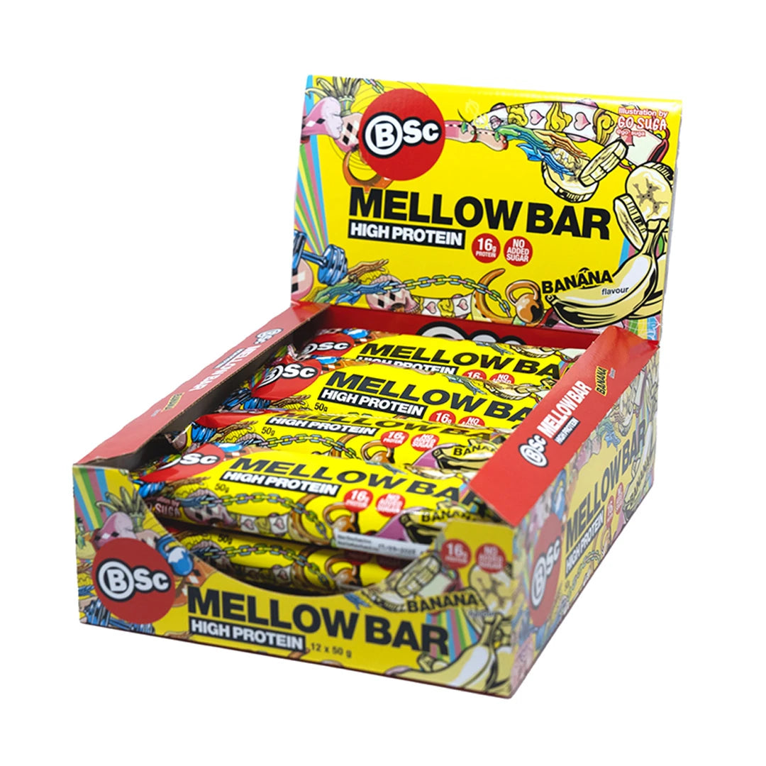 12 x BSc Mellow Bar 50 g Banana i en fargerik gul displayeske med lekne illustrasjoner.