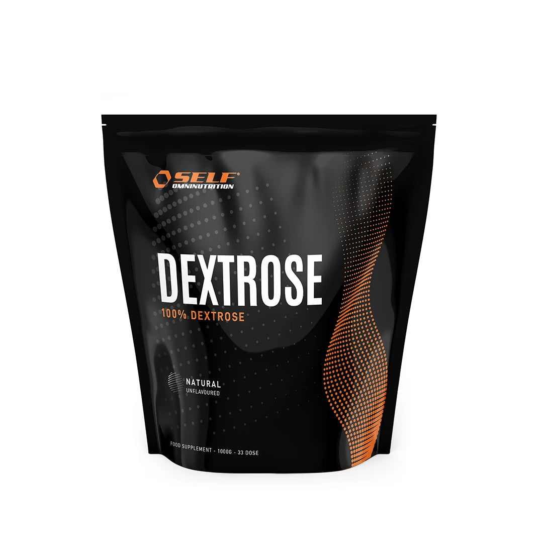 Self Omninutrition Dextrose 1 kg pakket i en svart pose med oransje detaljer og tekst for produkttypen karbohydrater.