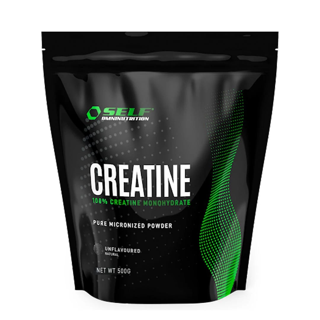 Self Omninutrition Creatine 500 g kreatinpulver i en svart pose med grønne detaljer og smaken naturell.