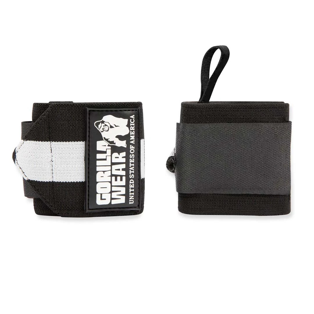 Gorilla Wear Wrist Wraps Ultra Black/White, elastiske svarte håndleddsbind med hvite detaljer, logo og tommelløkke.
